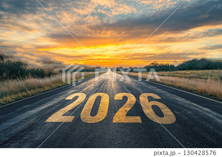 The text 2026 on the road with beautiful natural landscape and sunset sky. The text 2026 on the road with beautiful natural landscape and sunset sky. 130428576