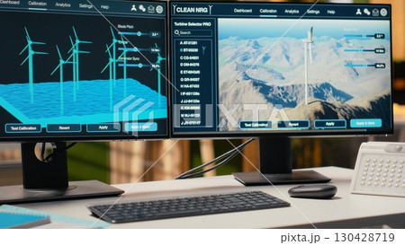 Software interface on PC used for planning wind farm layouts, determining optimal turbine placements. CAD program on computer in engineering office used to design windmills farm configurations 130428719
