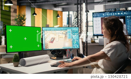 Developer in a corporate workspace analyzing master plans with mockup screen, infrastructure strategy and site preparation details to ensure housing and property investment success. Developer in a corporate workspace analyzing master plans with mockup screen, infrastructure strategy and site preparation details to ensure housing and property investment success. 130428721