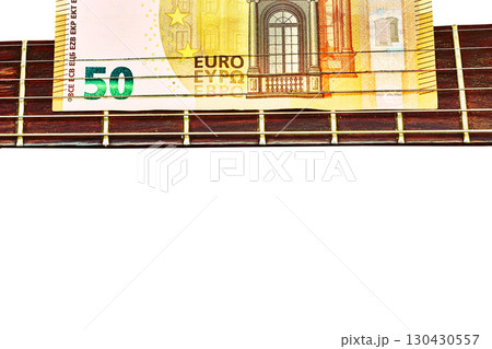 Money.Fee. 50 euro banknote on a rock electric guitar 130430557