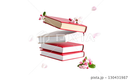 A stack of colorful books decorated with red ribbons, representing a journey of education and the pursuit of knowledge, isolated on a white background. 130431987