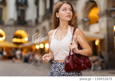 Young woman walking in Royal Square (Placa Real) in Barcelona Young woman walking in Royal Square (Placa Real) in Barcelona 130432673