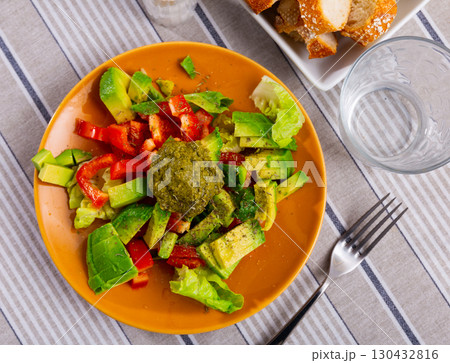 Salad with avocado and pesto sauce Salad with avocado and pesto sauce 130432816
