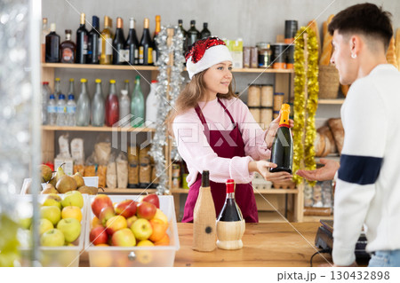 Young woman seller offers cheese to man 130432898