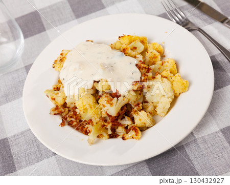 Plate of delicious boiled cauliflower with spicy sauce Plate of delicious boiled cauliflower with spicy sauce 130432927