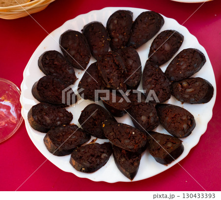 Sliced burgos blood sausage served on platter Sliced burgos blood sausage served on platter 130433393