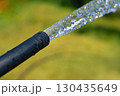 Hose with pouring water to water plants.Landscaping,gardening 130435649