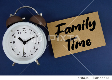 Family time text with alarm clock on blue background Family time text with alarm clock on blue background 130435678