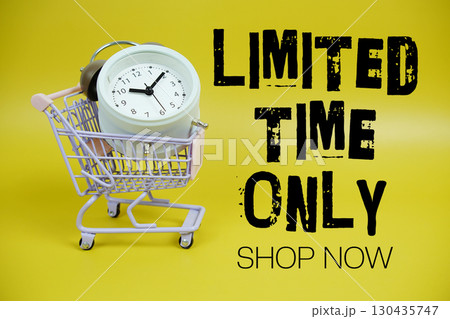 Limited Time Only text with trolley shopping cart and alarm clock on yellow background Limited Time Only text with trolley shopping cart and alarm clock on yellow background 130435747