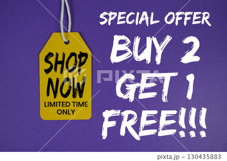 Buy 2 Get 1 Free!!! special offer with price tag on purple background 130435883