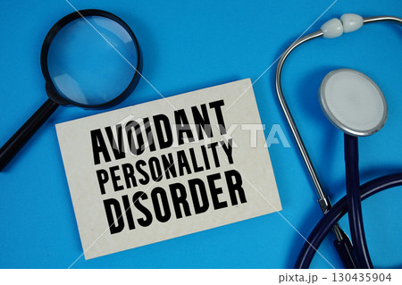 Avoidant Personality Disorder  text with Stethoscope and magnifying glass on blue background 130435904
