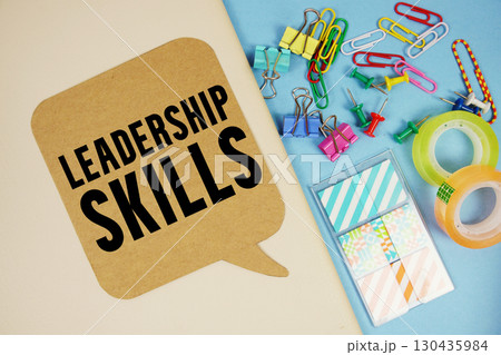 Leadership Skills text with stationery on cover notebook background Leadership Skills text with stationery on cover notebook background 130435984