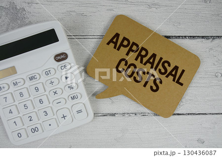 Appraisal Costs text with calculator on wooden background Appraisal Costs text with calculator on wooden background 130436087