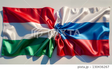 flags of russia and hungary tied in a knot and lying next to each other on a white background flags of russia and hungary tied in a knot and lying next to each other on a white background 130436267