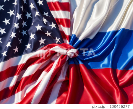 flags of the usa and russia tied in a knot and lying next to each other, concept of cooperation flags of the usa and russia tied in a knot and lying next to each other, concept of cooperation 130436277