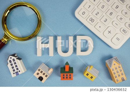HUD abbreviation of Planned Unit Development alphabet letters with house model, magnifying glass and calculator on blue background 130436632
