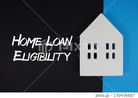Home Loan Eligibility text with house models on black background 130436687