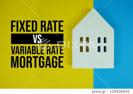 Fixed Rate Vs Variable Rate Mortgage text with house models on yellow background Fixed Rate Vs Variable Rate Mortgage text with house models on yellow background 130436693