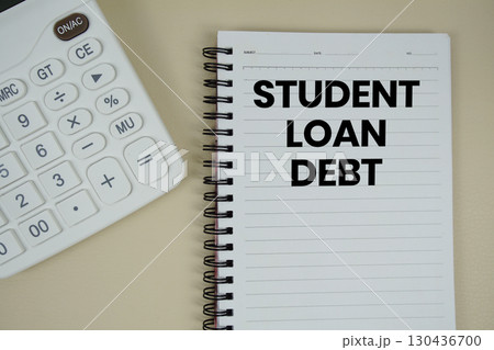 Student Loan Debt text with calculator phrase of business and financial concept 130436700