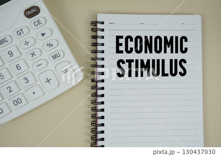 Economic Stimulus text with calculator phrase of business and financial concept Economic Stimulus text with calculator phrase of business and financial concept 130437030