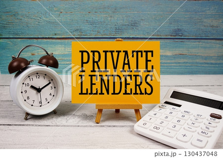 Private Lenders text written on paper card with calculator and alarm clock on wooden background Private Lenders text written on paper card with calculator and alarm clock on wooden background 130437048