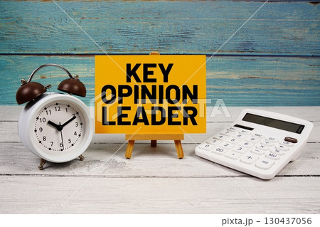 Key Opinion Leader (KOL) text written on paper card with calculator and alarm clock on wooden background Key Opinion Leader (KOL) text written on paper card with calculator and alarm clock on wooden background 130437056