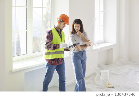 Builder And Client Discussing Home Renovation Blueprint Together Builder And Client Discussing Home Renovation Blueprint Together 130437340