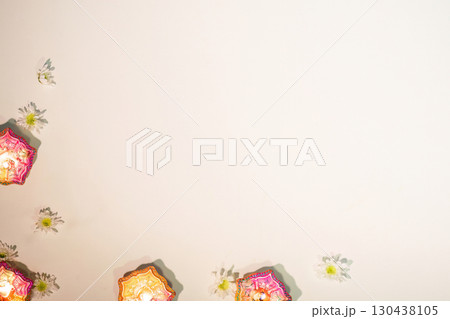 Diwali Festival. Simple Arrangement of Diyas and Flowers for Celebratory Mood Diwali Festival. Simple Arrangement of Diyas and Flowers for Celebratory Mood 130438105