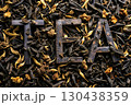 Black yellow Inscription with letters Tea, dried herbal leaves for drinks 130438359