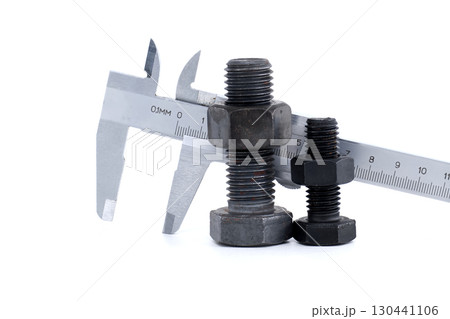 Close-Up of Bolts Measured with Vernier Caliper on a White Background 130441106
