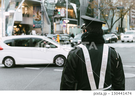 Japanese Traffic police officer working operation at busy road in the downtown street for safety 130441474