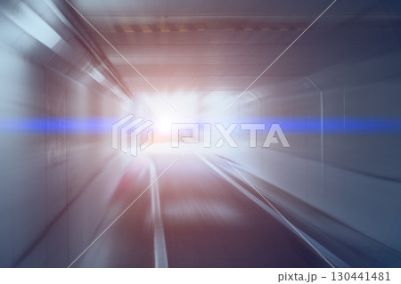 Way out, Exit way, Fast moving zoom motion blur tunnel road escape, rushing towards brightly light 130441481