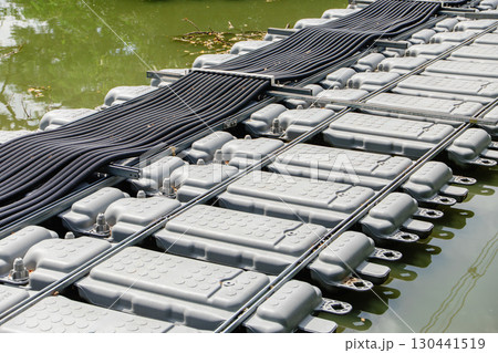 Floating Solar Panel electricity cable. Solar photovoltaic panel PV System in water pond lake 130441519