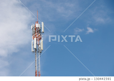 Communication towers on blue sky, 5G networks post. Network cell site. Omni direction data link Communication towers on blue sky, 5G networks post. Network cell site. Omni direction data link 130441591