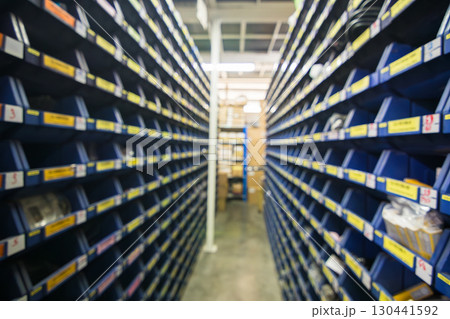 Blur parts storage room in industry factory warehouse store electronic parts and machine parts shelf 130441592