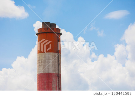 High smoke stack chimney low carbon emission against blue sky, Green Industry zone saving ecology industrial. 130441595