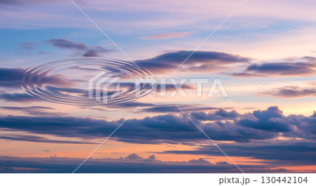 Fantasy background concept showing dramatic sunset sky with water ripple, surreal evening cloudscape with mysterious liquid motion for abstract wallpaper or creative art 130442104