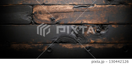 Weathered dark wooden planks with black brown burnt texture ideal for rustic backgrounds advertising decoration web layout designs 130442126