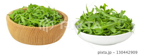 Heap of green fresh rucola or arugula leaf in wooden and ceramic bowl isolated on white background 130442909