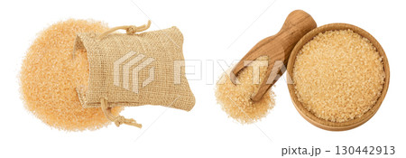 The brown sugar in a bag and wooden bowl isolated on white background. Top view, flat lay 130442913
