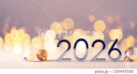 Metal numbers 2026 on table with bokeh lights. 130443500