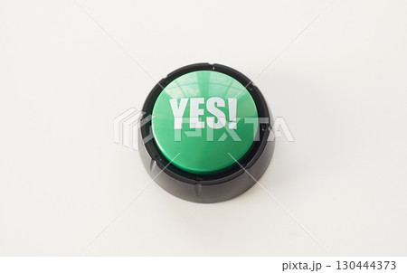 Yes text on green round button, top view of key to press with finger and choose positive answer Yes text on green round button, top view of key to press with finger and choose positive answer 130444373