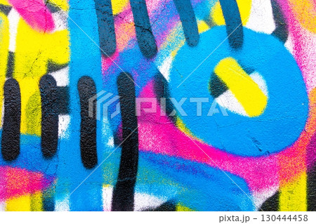 Vibrant Graffiti Texture with Neon Blue, Pink, Yellow in 80s Street Style 130444458
