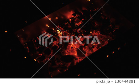 closeup of hot charcoal in dark environment 130444881