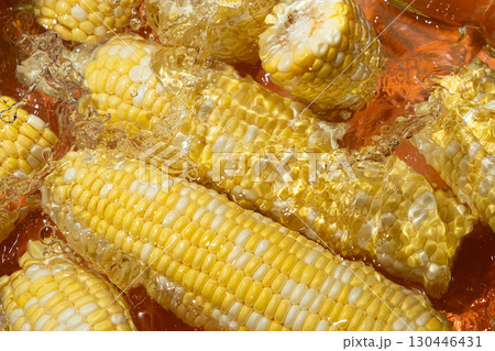 Fresh Corn Cobs Splashing in Water Top View. Fresh Corn Cobs Splashing in Water Top View. 130446431