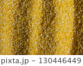 Abstract Yellow Cooking Corn Grits Background. 130446449