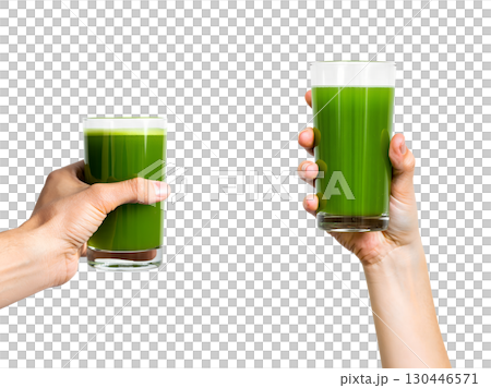 Close-up of hand holding fresh green smoothie with spinach, healthy lifestyle choice isolated 130446571