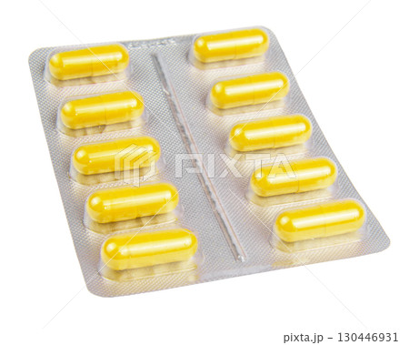 Yellow pills in the blister pack, isolated on white Yellow pills in the blister pack, isolated on white 130446931