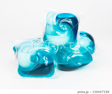 Capsules for washing laundry detergents for washing clothes in a washing machine isolated on a white background. Capsules for washing laundry detergents for washing clothes in a washing machine isolated on a white background. 130447199