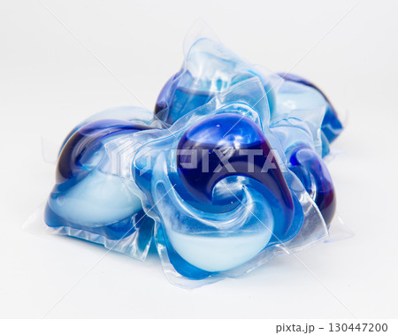 Capsules for washing laundry detergents for washing clothes in a washing machine isolated on a white background. 130447200